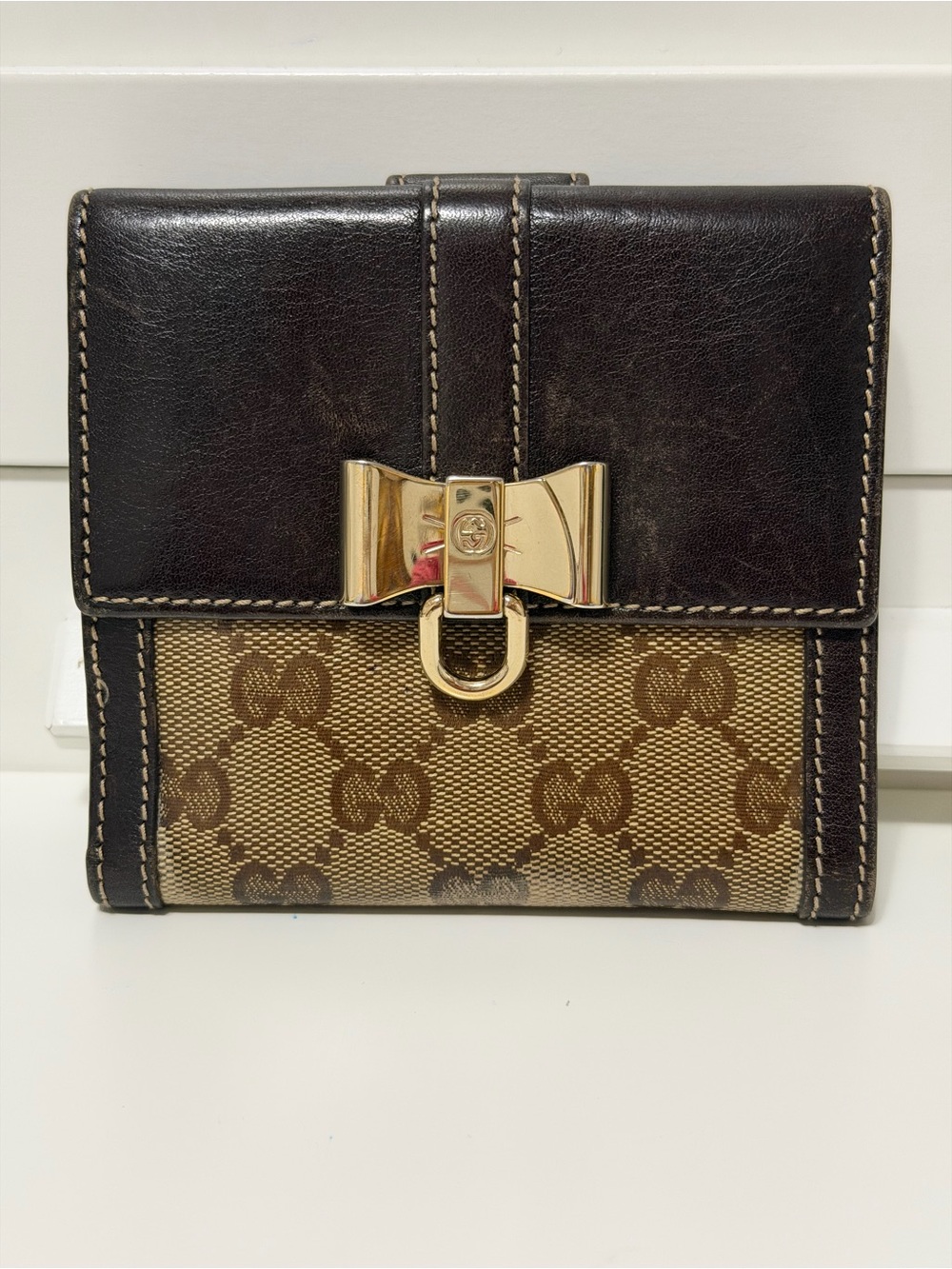 Gucci monogram bow compact wallet